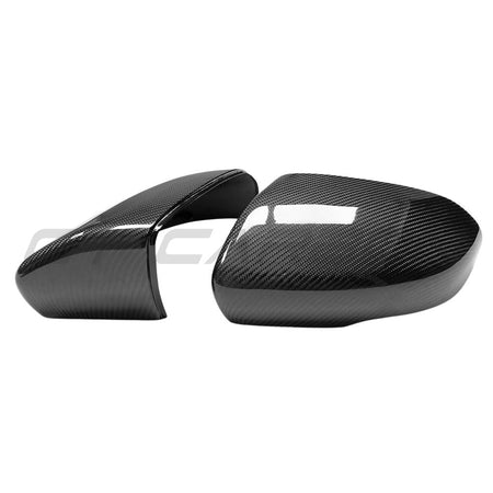 Pair of carbon fiber side mirror caps for a modern vehicle, displayed against a white background with a faint CT Carbon watermark.