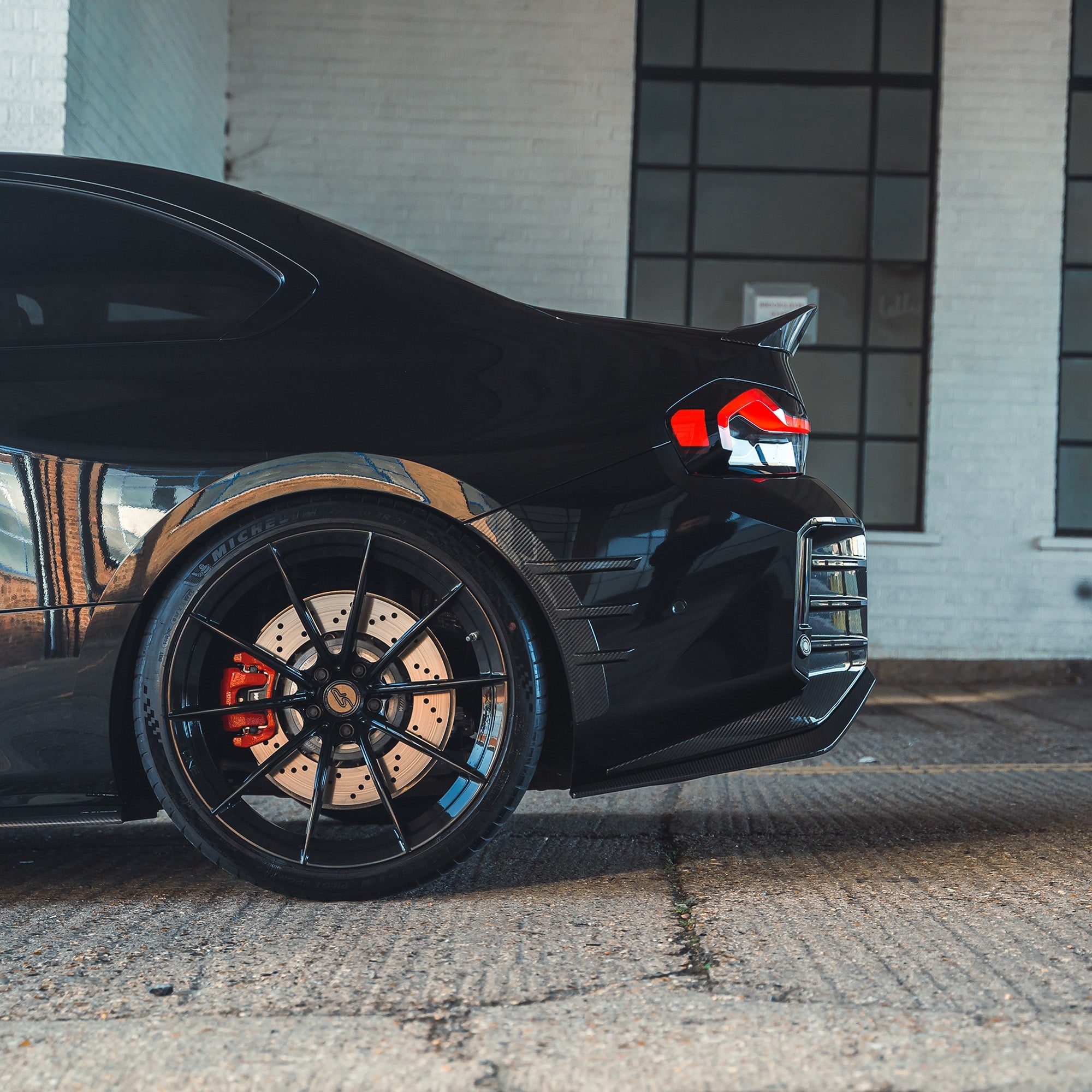 BMW G87 M2 CARBON FIBRE REAR BUMPER TRIM-Accessories-CT CARBON-CT Carbon - High-quality carbon fiber and gloss black aerodynamic parts for premium sports and luxury vehicles.