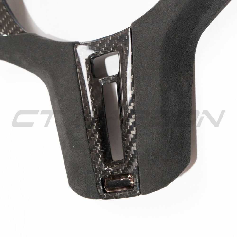 BMW Gxx M CAR CARBON FIBRE STEERING WHEEL TRIM - HEATING-Accessories-CT CARBON-CT Carbon - High-quality carbon fiber and gloss black aerodynamic parts for premium sports and luxury vehicles.