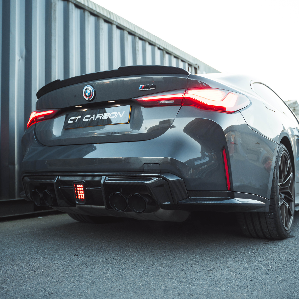 BMW M3/M4 G80/G81/G82/G83 CARBON FIBRE DIFFUSER WITH LED - CT DESIGN-Diffuser-CT CARBON-CT Carbon - High-quality carbon fiber and gloss black aerodynamic parts for premium sports and luxury vehicles.