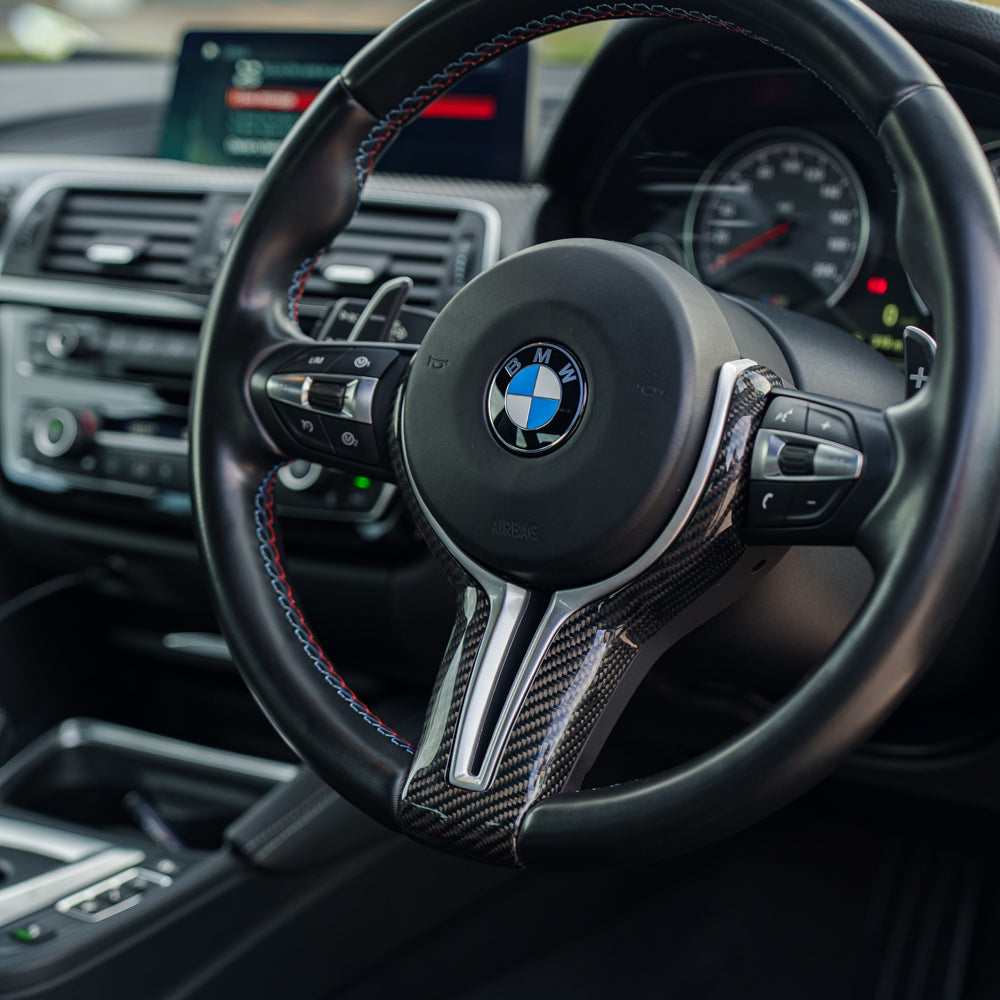 BMW Fxx M CAR CARBON FIBRE STEERING WHEEL TRIM-Accessories-CT CARBON-CT Carbon - High-quality carbon fiber and gloss black aerodynamic parts for premium sports and luxury vehicles.