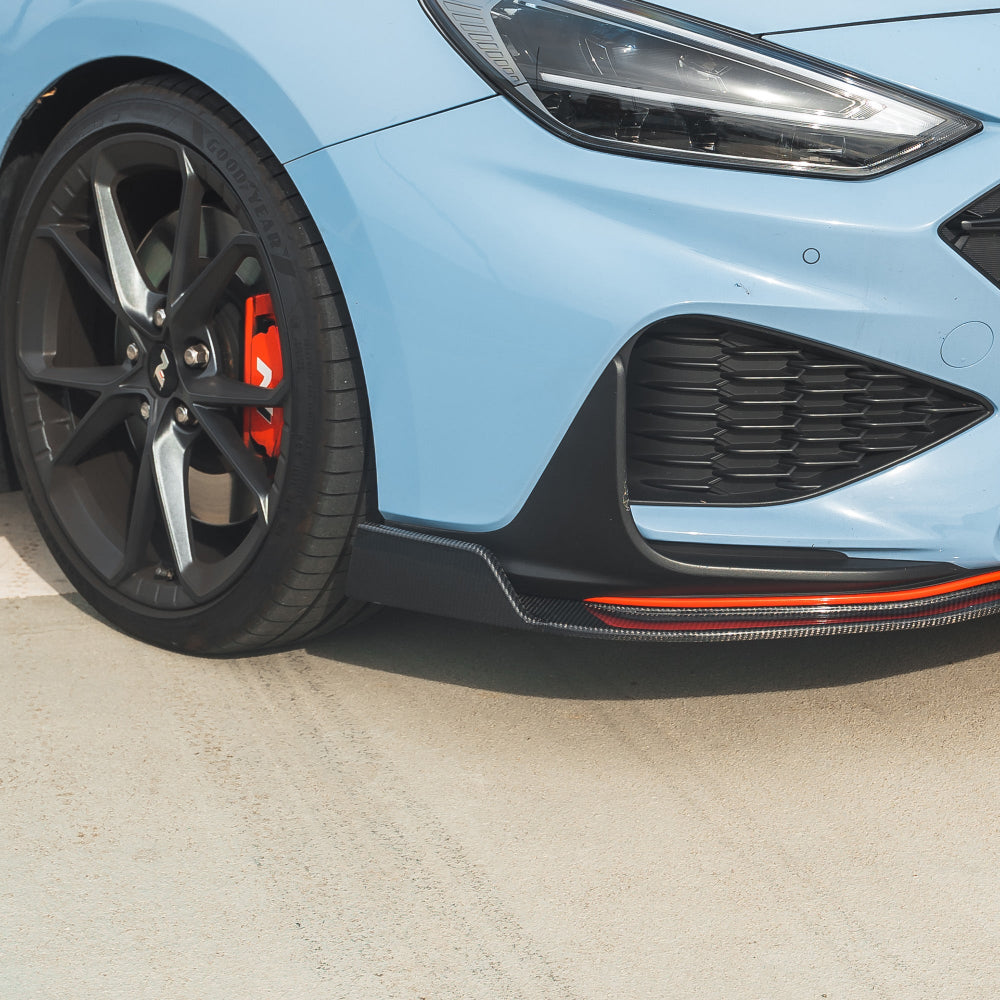 HYUNDAI i30N FRONT CARBON FIBRE SPLITTER (FACELIFT) - CT DESIGN-Splitter-CT CARBON-CT Carbon - High-quality carbon fiber and gloss black aerodynamic parts for premium sports and luxury vehicles.
