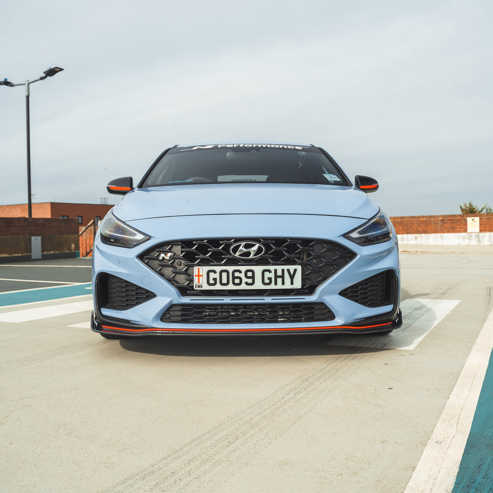 HYUNDAI i30N FRONT CARBON FIBRE SPLITTER (FACELIFT) - CT DESIGN-Splitter-CT CARBON-CT Carbon - High-quality carbon fiber and gloss black aerodynamic parts for premium sports and luxury vehicles.