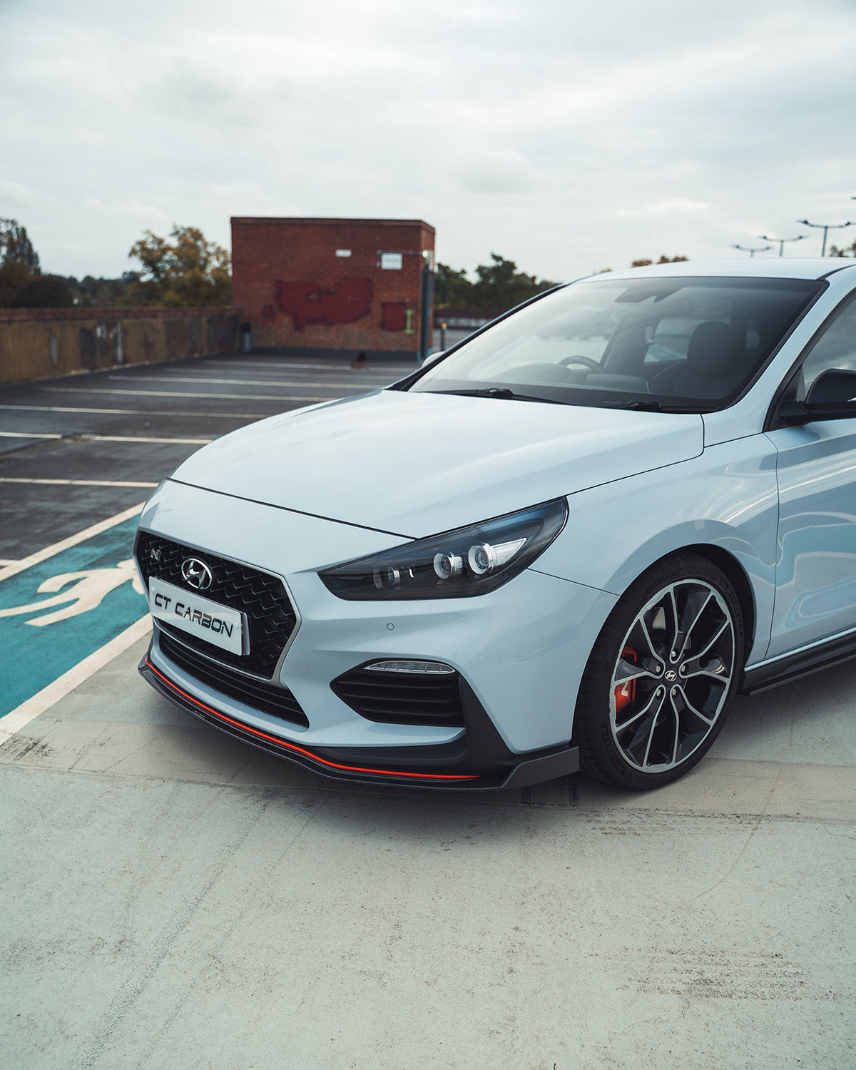 HYUNDAI i30N FRONT CARBON FIBRE SPLITTER (PRE-FACELIFT) - CT DESIGN-Splitter-CT CARBON-CT Carbon - High-quality carbon fiber and gloss black aerodynamic parts for premium sports and luxury vehicles.
