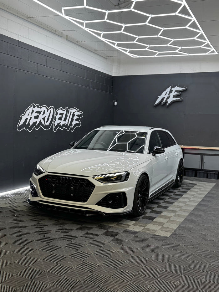 Audi RS4 B9 Avant front three-quarter hero shot after bodykit fitment