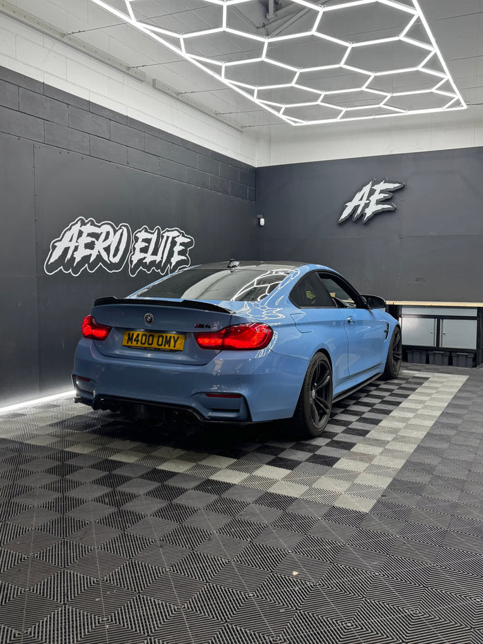 BMW M4 (F82) rear three-quarter view after fitting a carbon rear diffuser with LED light strip