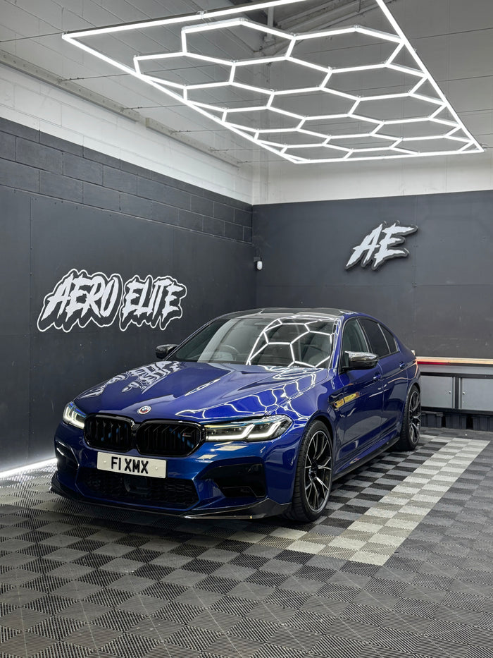BMW M5 (F90) after carbon fibre front splitter fitment by Aero Elite, front three-quarter view