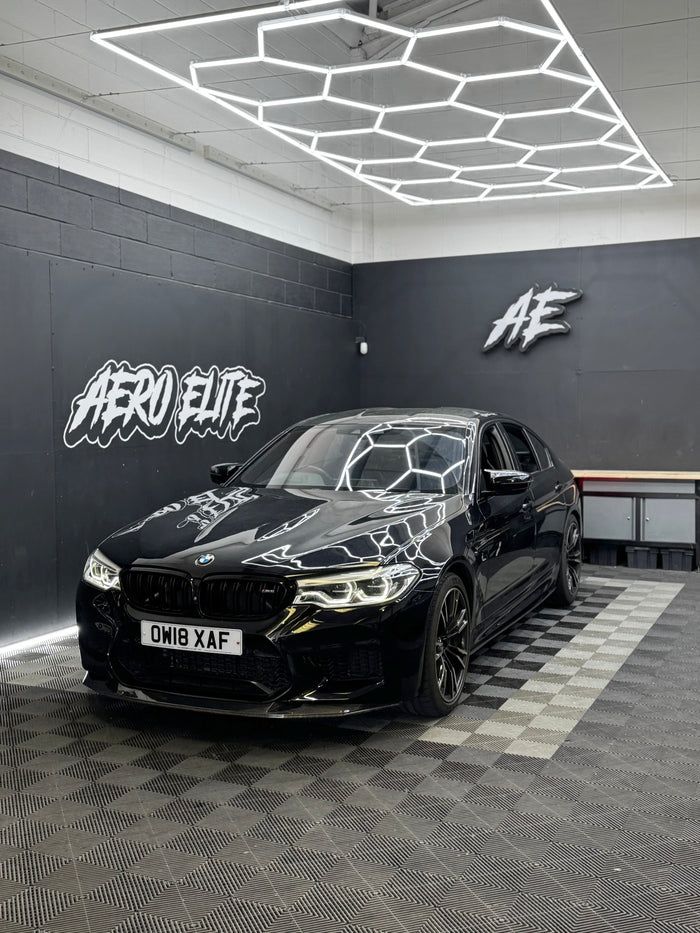 BMW M5 F90 after Aero Elite bodykit fitment — front splitter, side skirts and diffuser