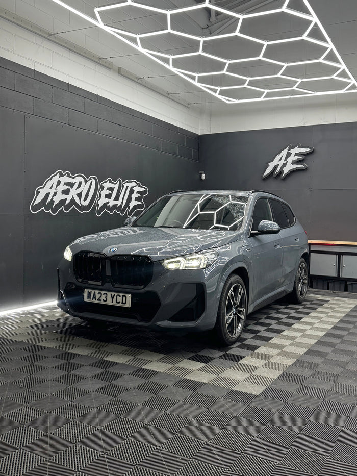BMW X1 (U11) front three-quarter view after gloss black grille upgrade