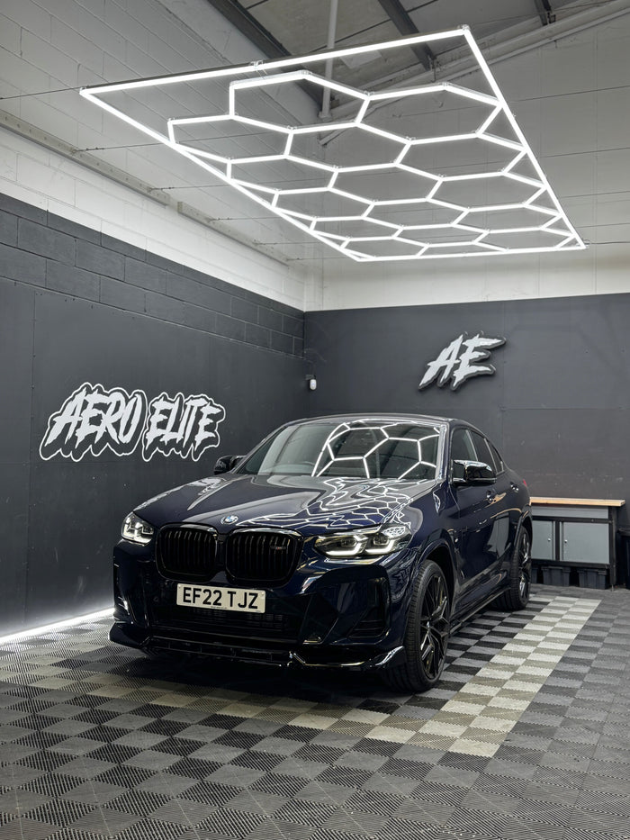 BMW X4 (G02) with front splitter, side skirts, diffuser and spoiler by Aero Elite, front three-quarter view