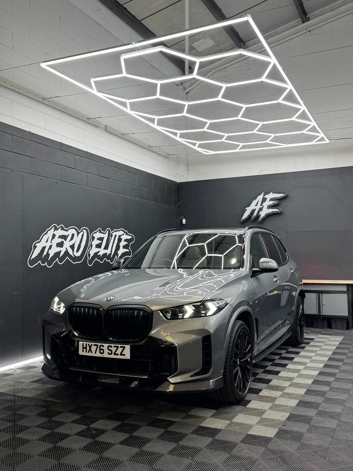 BMW X5 (G05) with front splitter, side skirts, diffuser and spoiler by Aero Elite, front three-quarter view