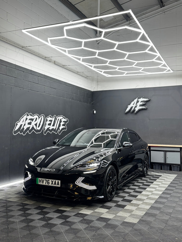 BYD Seal (MK1) with front splitter, side skirts, diffuser and spoiler by Aero Elite, front three-quarter view