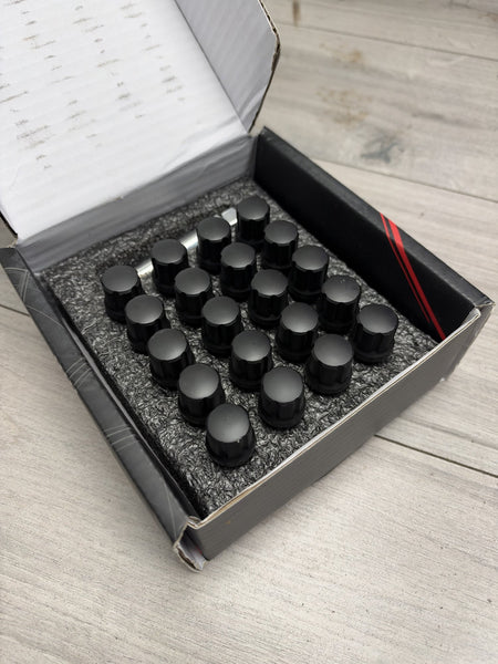 Actual in-stock set: Japan Racing JB1 black M12x1.5 wheel bolts, boxed with key