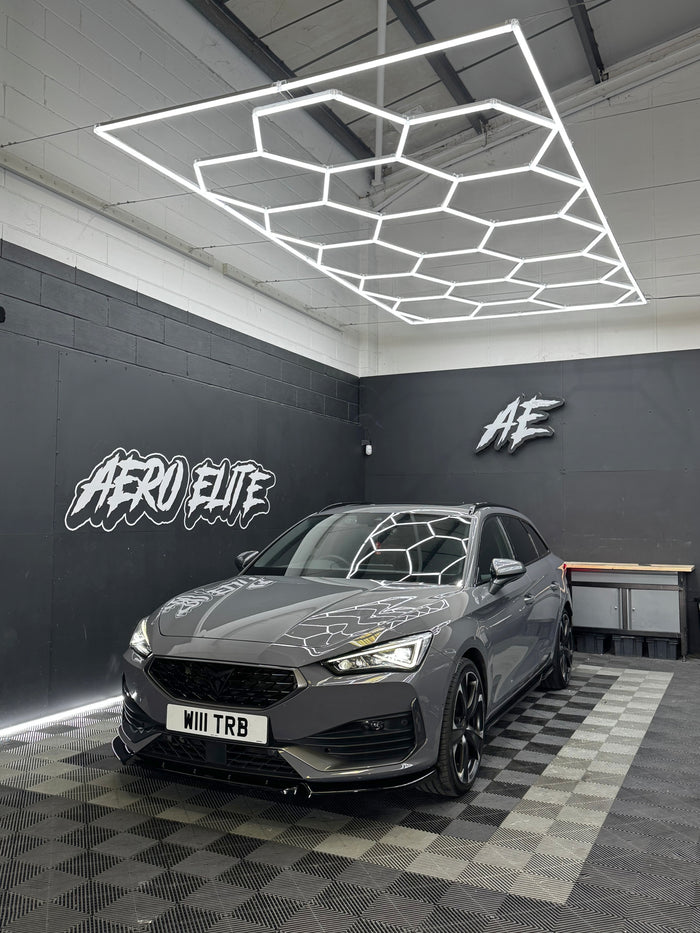 Cupra Leon Estate with front splitter and side skirts by Aero Elite, front three-quarter view