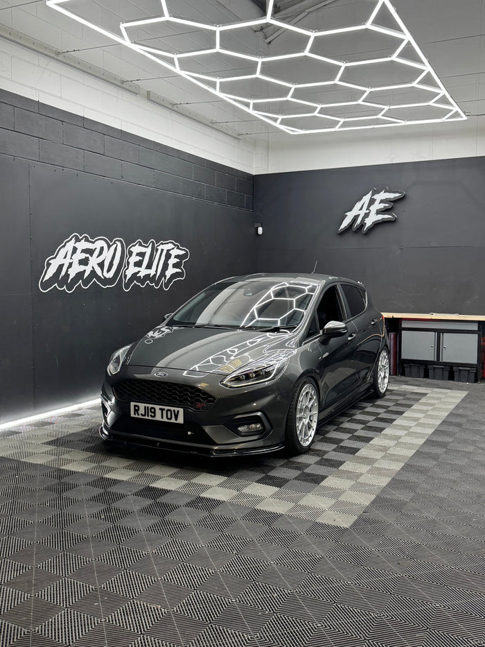 Ford Fiesta ST MK8 front three-quarter hero shot with lowered suspension and new alloy wheels