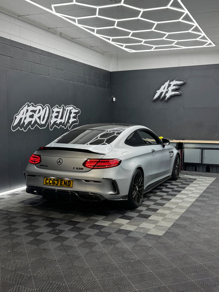 Mercedes-AMG C63S W205 after carbon rear bumper corner fitment — rear three-quarter view