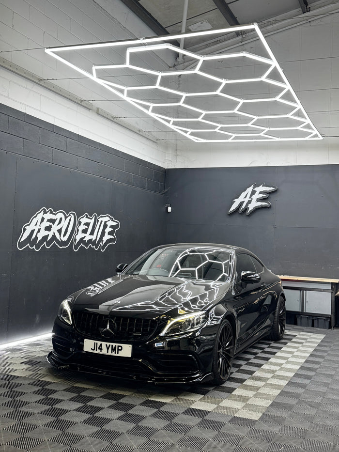 Mercedes C63 AMG (W205) with carbon splitter by Aero Elite, front three-quarter view