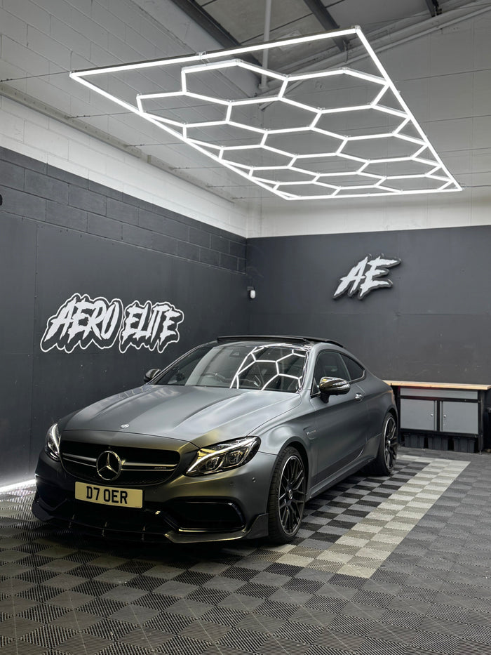 Mercedes C63 AMG (W205) matte wrap with carbon front splitter and rear diffuser by Aero Elite, front three-quarter view