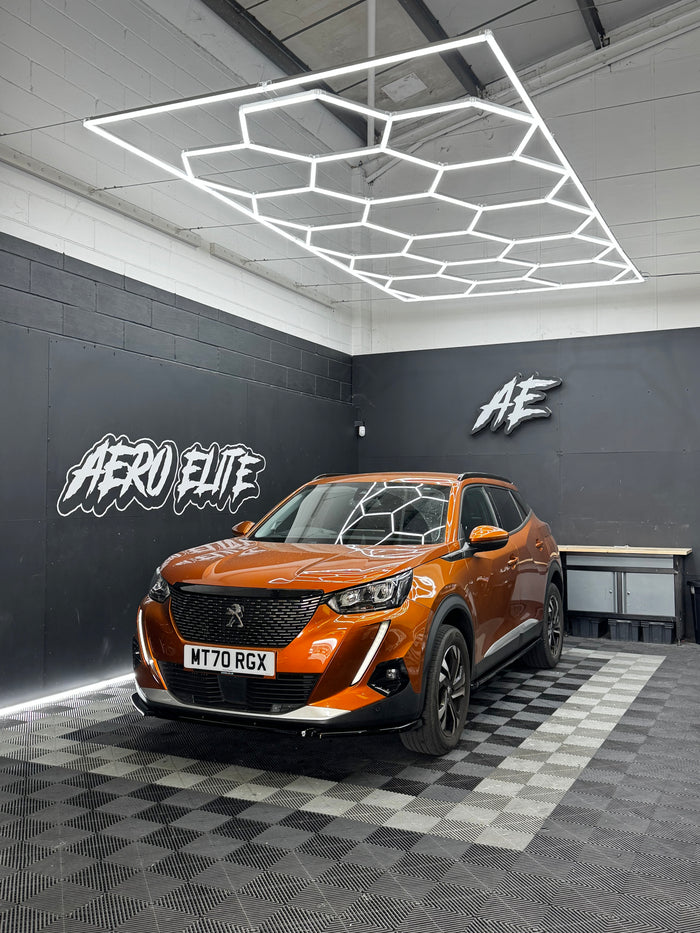 Peugeot 2008 with front splitter, side skirts and spoiler by Aero Elite, front three-quarter view