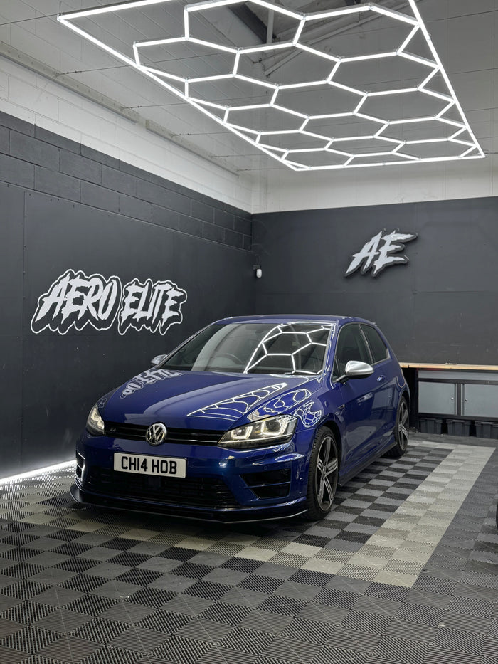 Blue Volkswagen Golf R (MK7) with front splitter by Aero Elite, front three-quarter view
