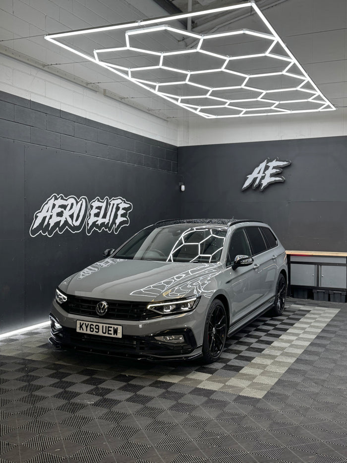 Volkswagen Passat B8 after full bodykit, side skirts, spoiler and window tints — side profile