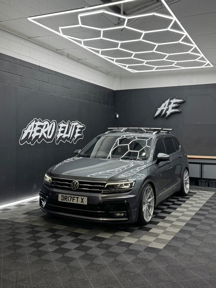 VW Tiguan after new alloy wheel fitment — front three-quarter view